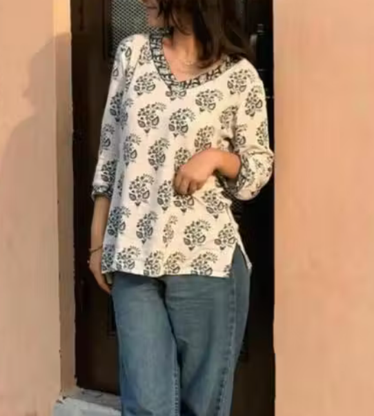 Pure Cotton Flower Printed V-Neck Designer Short Kurti For Women And Girls Best Comfy White Short Kurta With Blue Flower Print All Over The Kurti And Blue Flower Printed Lace Border Attached on Neckline And Sleeve