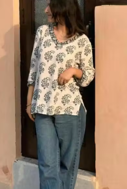Pure Cotton Flower Printed V-Neck Designer Short Kurti For Women And Girls Best Comfy White Short Kurta With Blue Flower Print All Over The Kurti And Blue Flower Printed Lace Border Attached on Neckline And Sleeve
